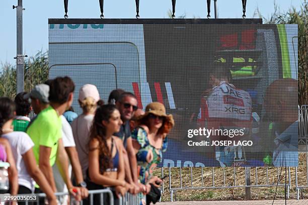 Team UAE's Slovenian rider Tadej Pogacar is seen entering an ambulance after crashing on a giant screen in the finish area of the Vuelta a Espana...