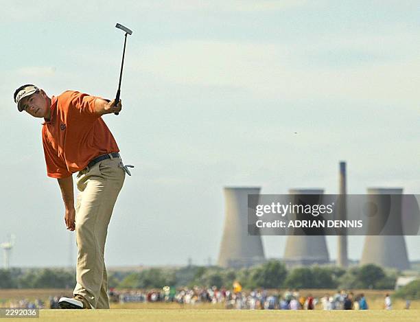 Golfer Ben Curtis celebrates a putt on the 12th green during the final round at The Open Championship at Royal St. George's in Sandwich 20 July...