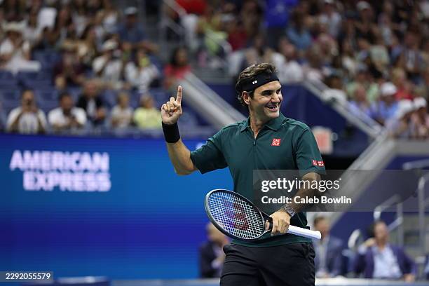Roger Federer of Switzerland reacts after playing a shot in the exhibition singles match against Andy Roddick of the United States during Fan Week at...