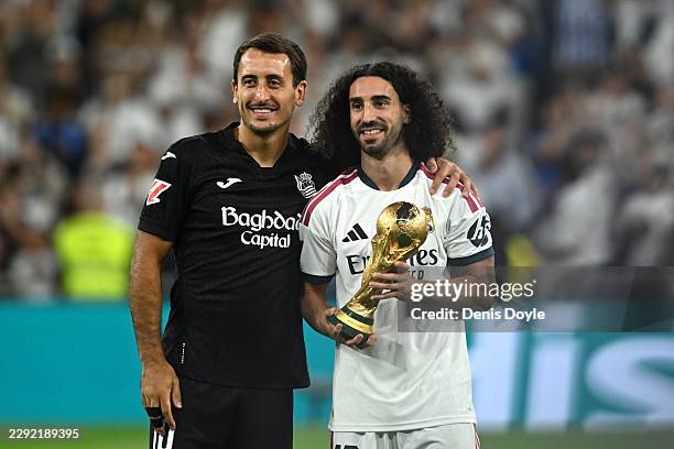 Marc Cucurella of Real Madrid and Mikel Oyarzabal of Real Sociedad present the FIFA World Cup trophy to the fans before the LaLiga EA Sports 2026/27...