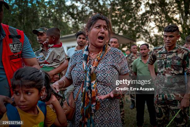 Resident awaits news of missing relatives at a military camp, following flash floods on August 27, 2026 in Trishuli, Nepal. A sudden flood swept...