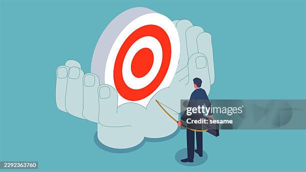 setting plans and goals, accomplishing or achieving something, self-improvement or progress, milestones. an isometric view shows a merchant holding a bow and arrow, looking at the giant target in the giant’s hand - right first time stock illustrations