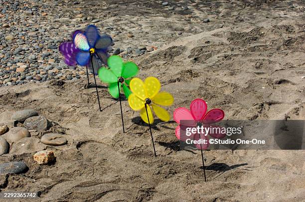 multi-colored spinners - wind spinner stock pictures, royalty-free photos & images