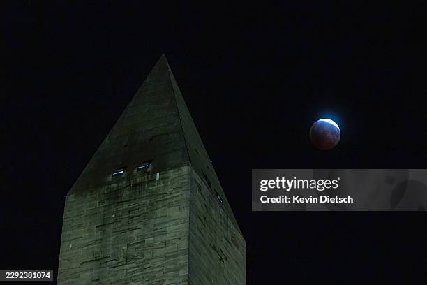 Partial lunar eclipse is seen behind the Washington Monument on August 27, 2026 in Washington, DC. The lunar eclipse, named the “almost blood moon,”...