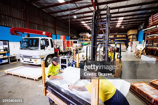 Warehouse Workers Using Forklift and Preparing Materials Warehouse Workers Using Forklift and Preparing Materials
