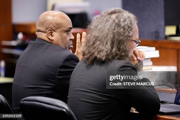 Duane Davis and his attorney Michael Sanft listen to rebuttal closing arguments in the Duane Davis murder trial, related to the 1996 killing of...