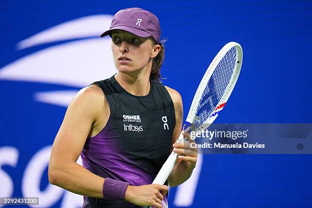 Iga Swiatek looks on against Xiyu Wang during a Women's Singles match on Day Two of the 2026 US Open at USTA Billie Jean King National Tennis Center...