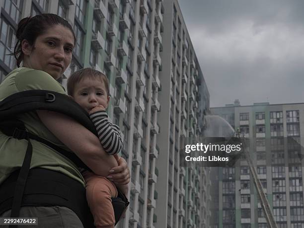 Firefighters of the State Emergency Service of Ukraine work to eliminate the consequences of a Russian drone strike at the Misto Kvitiv residential...