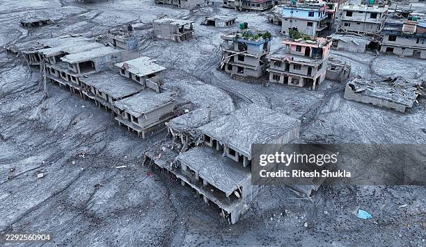 An Aerial view shows debris and mud covering settlements following flash floods on August 29, 2026 in DevGhat village, Nepal. Authorities said the...