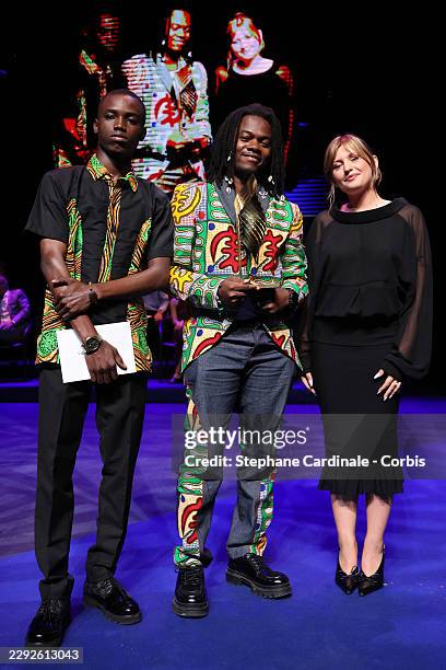 Rafiki Fariala and Lillo Morealle pose with the Best Music Valois Prize next to Marine Delplace during the Closing Ceremony at the 19th Angouleme...
