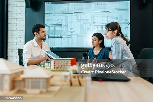 Architects team working on project plan. Architects team working on project plan.
