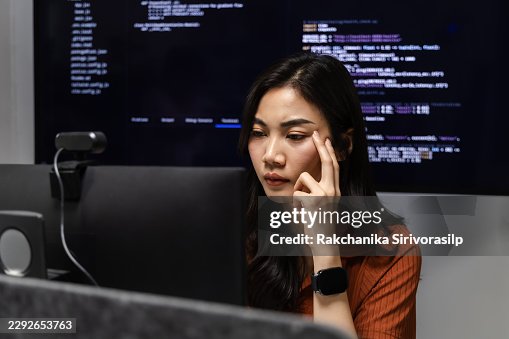 Focused software developer studying code across computer monitors in office, analyzing details and reviewing programming tasks to solve issues and support reliable software development. Focused software developer studying code across computer monitors in office, analyzing details and reviewing programming tasks to solve issues and support reliable software development.