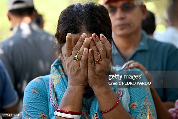 Relative of a missing flash flood victim weeps outside a temporary relief camp at Trishuli Bazar in Nepal's Nuwakot district on September 5, 2026....