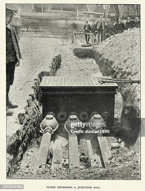 history, electrical engineering, tubes entering a junction box, for municipal lighting from underground mains, vintage photograph 19th century 1890s - cable installation stock illustrations