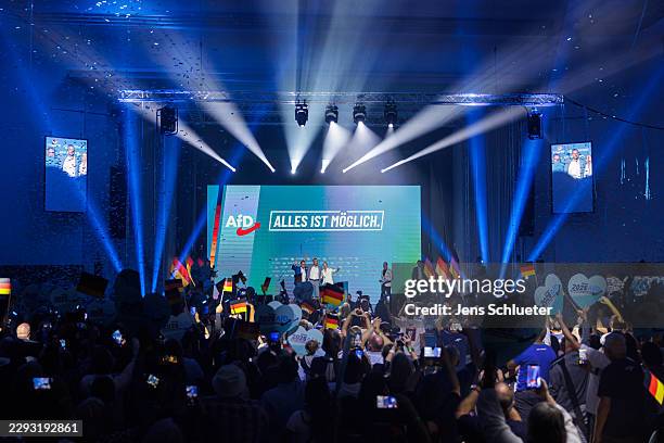 Alice Weidel and Tino Chrupalla , co-leaders of the far-right Alternative for Germany political party, stand on stage with AfD lead candidate Ulrich...