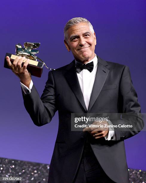 George Clooney receives the Golden Lion For Lifetime Achievement Award on stage at the Opening Ceremony during the 83rd Venice International Film...