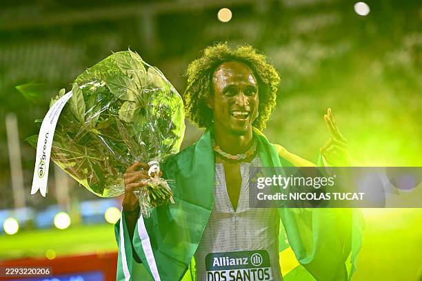 Brazil's Alison Dos Santos celebrates after winning the men's 400m Hurdles final during the World Athletics Diamond League athletics meeting at the...