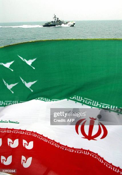An Iranian Revolutionary Guards boat patrol escorts the ship of relatives of victims of the Iranian Airbus which was attacked by US Navy cruiser...