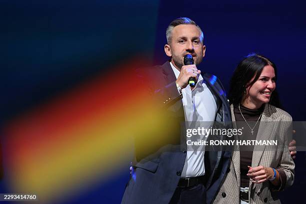 Ulrich Siegmund , far-right Alternative for Germany 's main candidate in the Saxony-Anhalt state election, addresses supporters next to his wife...