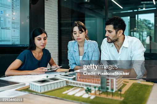 Architects team working on project plan. Architects team working on project plan.
