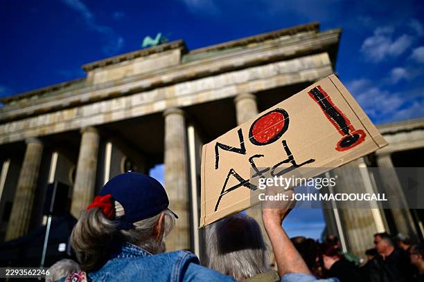 Participant displays a placard with the lettering 'No AfD' in front of the Brandenburg Gate in Berlin on September 7 during a rally under the motto...