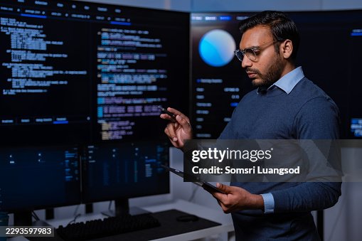 Software developer checking code with digital tablet Software developer checking code with digital tablet