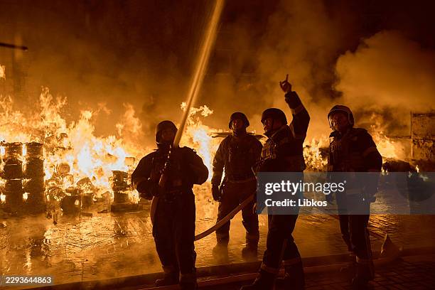 Firefighters deal with the aftermath of a massive Russian missile and drone attack on September 8, 2026 in Kyiv, Ukraine. According to local...