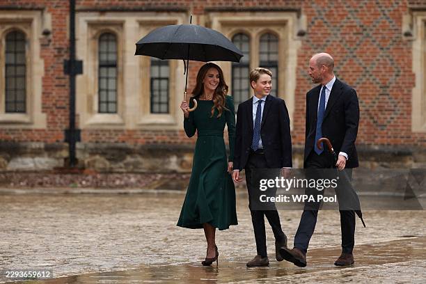 Catherine, Princess of Wales and Prince William, Prince of Wales walk with their 13-year-old son, Prince George of Wales , as he arrives for his...