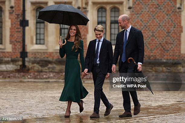 Catherine, Princess of Wales and Prince William, Prince of Wales walk with their 13-year-old son, Prince George of Wales , as he arrives for his...