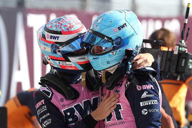 Pole position qualifier Pierre Gasly of France and Alpine F1 is congratulated by Eighth placed qualifier Franco Colapinto of Argentina and Alpine F1...