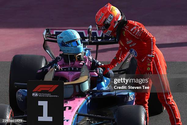 Pole position qualifier Pierre Gasly of France and Alpine F1 is congratulated by Fourth placed qualifier Charles Leclerc of Monaco and Scuderia...