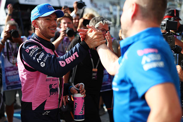 Pole position qualifier Pierre Gasly of France and Alpine F1 celebrates with a teammate during qualifying ahead of the F1 Grand Prix of Italy at...