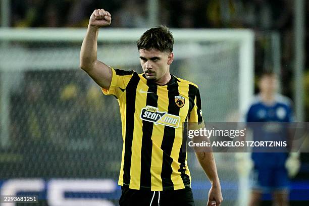 Athens' Romanian midfielder Razvan Marin celebrates scoring his team's first goal during the UEFA Champions League - League phase, Matchday 1 -...