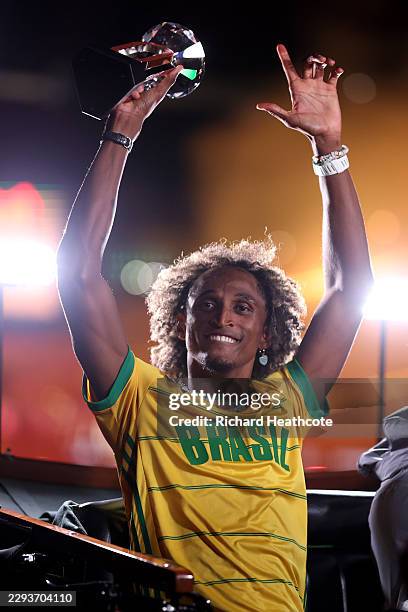 Alison dos Santos of Team Brazil celebrates with his trophy after winning the Men's 400m Hurdles Final during the Allianz Memorial Van Damme, part of...