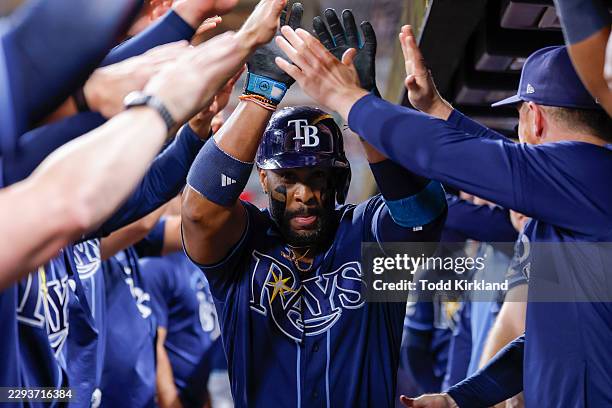 Yandy Diaz of the Tampa Bay Rays reacts after hitting a home run during the eighth inning against the Atlanta Braves at Truist Park on September 8,...