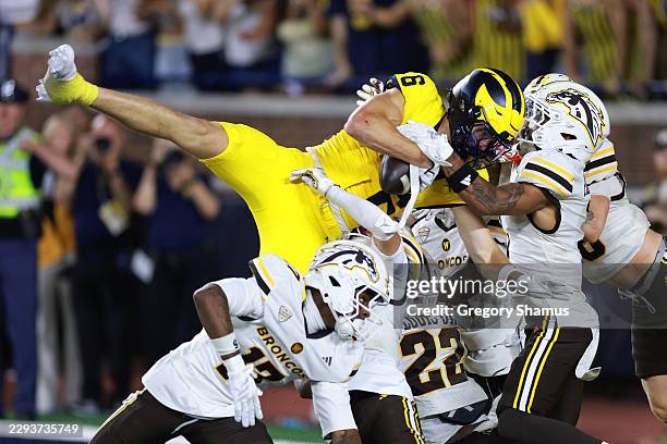Buchanan of the Michigan Wolverines catches a game winning pass with no time left on the clock to beat the Western Michigan Broncos 13 to 12 at...