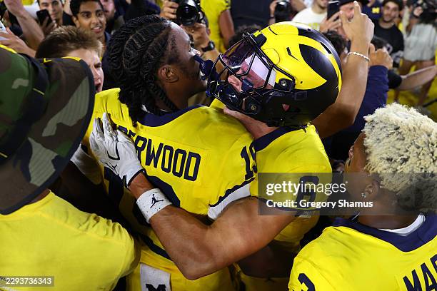 Bryce Underwood and JJ Buchanan of the Michigan Wolverines celebrate a 13-12 win over the Western Michigan Broncos at Michigan Stadium on September...