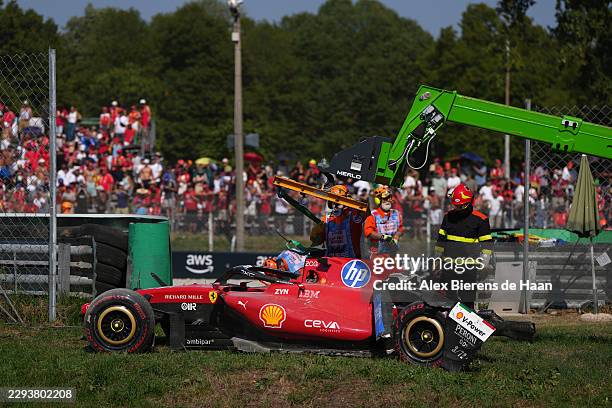 Crane clears away the car of Charles Leclerc of Monaco driving the Scuderia Ferrari SF-26 during the F1 Grand Prix of Italy at Autodromo Nazionale...
