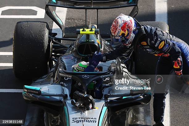 Race winner Andrea Kimi Antonelli of Italy and Mercedes AMG Petronas F1 Team is congratulated by Third placed Max Verstappen of the Netherlands and...