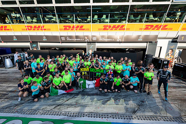 Second placed George Russell of Great Britain and Mercedes AMG Petronas F1 Team joins his team to celebrate during the F1 Grand Prix of Italy at...