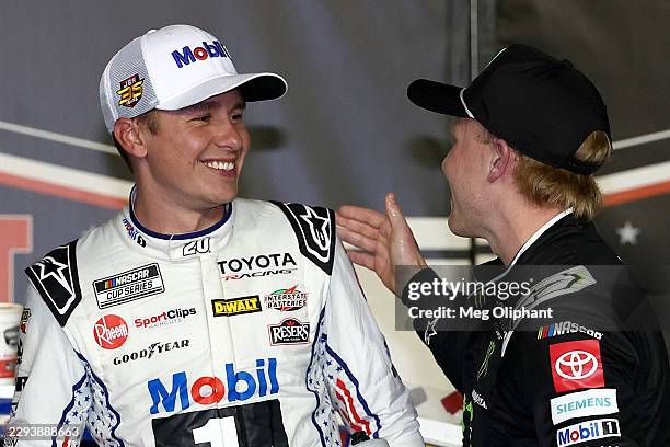Christopher Bell, driver of the Mobil 1 Toyota, is congratulated by Ty Gibbs, driver of the Monster Energy Toyota, in victory lane after winning the...