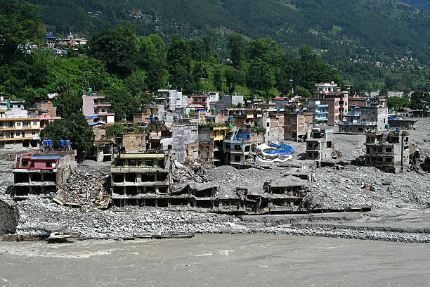 General view shows damaged houses covered in sludge in the aftermath of flash floods at Trishuli in Nepal's Nuwakot district on September 11, 2026.