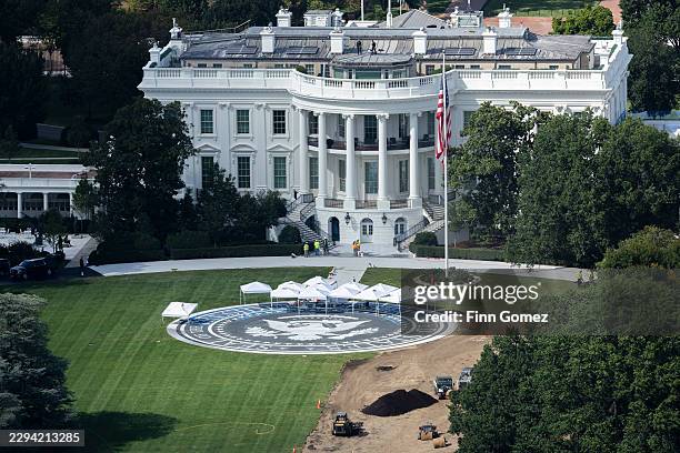 Workers re-do the lawn around the helipad on the south lawn of the White House on September 08, 2026 in Washington, DC. The new helipad has been...