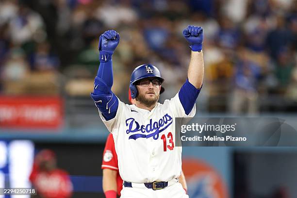Max Muncy of the Los Angeles Dodgers reacts after hitting a double during the sixth inning against the Cincinnati Reds at Dodger Stadium on September...