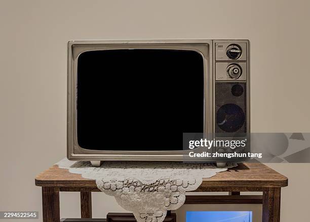 vintage television with blank screen on a table - lace table stock pictures, royalty-free photos & images
