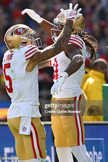 Demarcus Robinson of the San Francisco 49ers celebrates with Mike Evans of the San Francisco 49ers after scoring a touchdown in the second quarter of...