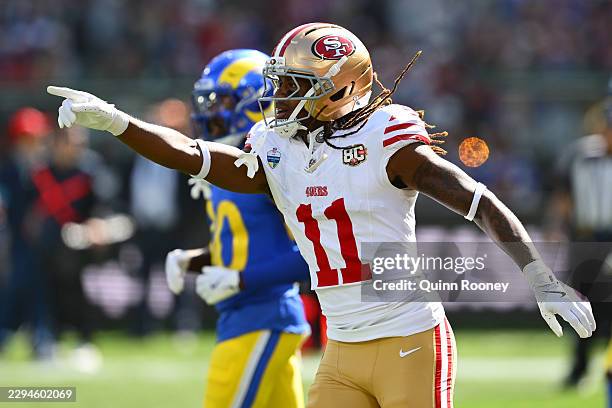 Demarcus Robinson of the San Francisco 49ers celebrates after scoring a touchdown in the second quarter of the NFL football game against the Los...