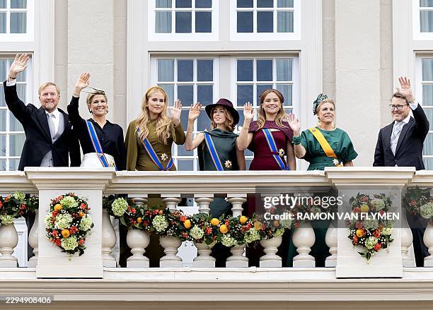 Dutch King Willem-Alexander, Queen Máxima, Princess Amalia, Princess Alexia, Princess Ariane, Princess Laurentien and Prince Constantijn wave to the...