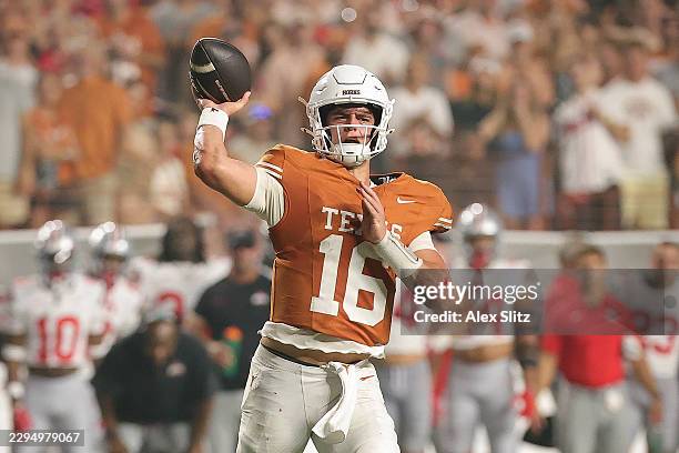 Arch Manning of the Texas Longhorns passes the ball against the Ohio State Buckeyes during the third quarter at Darrell K Royal-Texas Memorial...