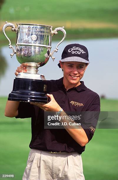 ANNIKA SORENSTAM OF SWEDEN HOLDS UP THE WINNERS'S TROPHY AFTER CAPTURING THE WOMEN'S U.S. OPEN TOURNAMENT AT THE BROADMOOR EAST GOLF COURSE IN...